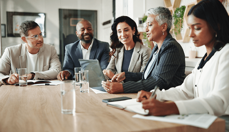 Corporate marketing team reviewing brand-approved advertising campaigns in a meeting