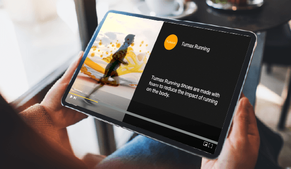 A person watching YouTube on an iPad with content playing on screen, connecting online video with a brand's engagement to the digital ecosystem.